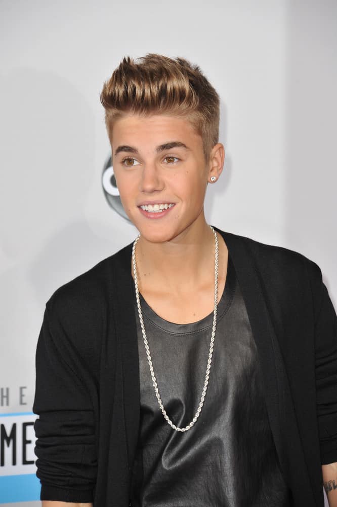 Justin Bieber shaved his sides short and rocked a quiff top during the 40th Anniversary American Music Awards held at the Nokia Theatre LA Live in 2012.