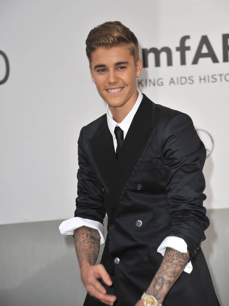 Justin Bieber looked dashing with his new look featuring a short slicked back hairstyle at the 21st annual amfAR Cinema Against AIDS Gala in 2014.