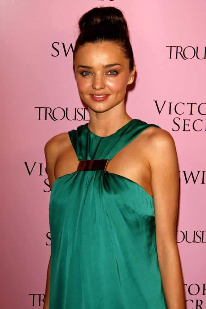 Miranda Kerr looking classy with her neat high bun during the Victoria's Secret's 5th anniversary of the Swim Catalogue at Trousdale in Los Angeles, California on March 25, 2010.