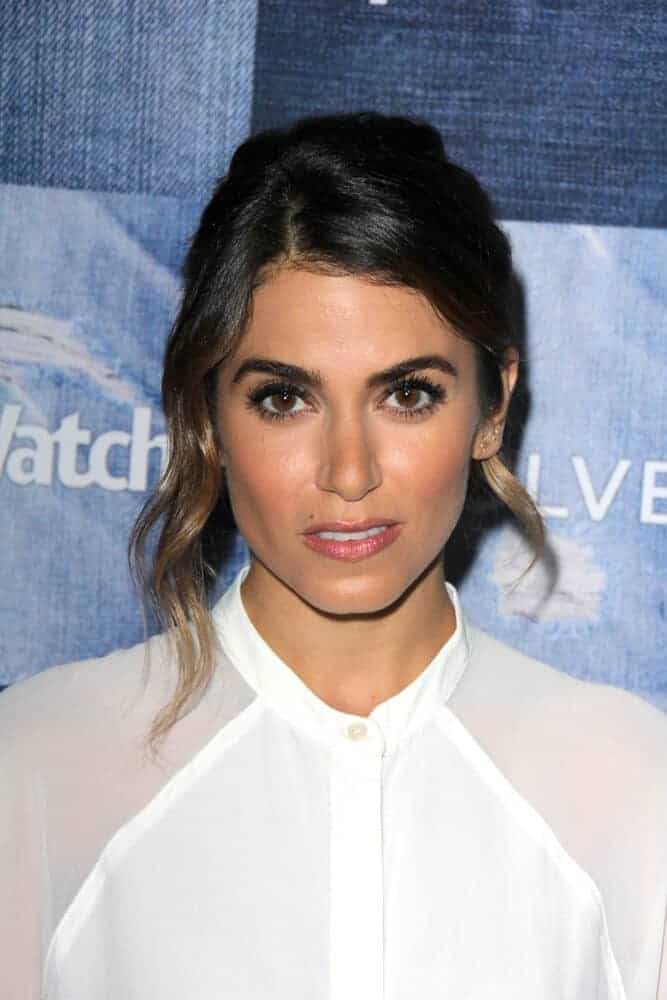 Last September 18, 2014 ,Nikki Reed attended the People Stylewatch Hosts Hollywood Denim Party with her casual hairstyle, a simple but presentable bun with hair tendrils.