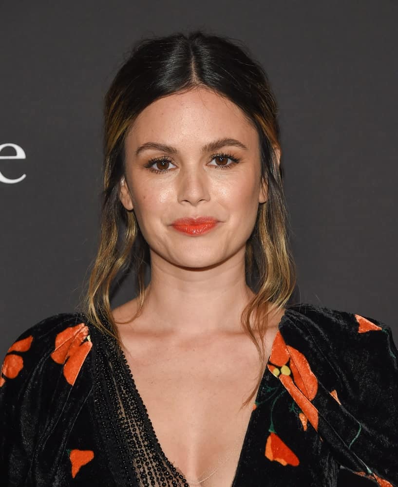 The actress attended the 2019 InStyle Awards on October 21st with a messy updo that's center-parted. Black velvet floral dress with deep V neckline completed the charming look.