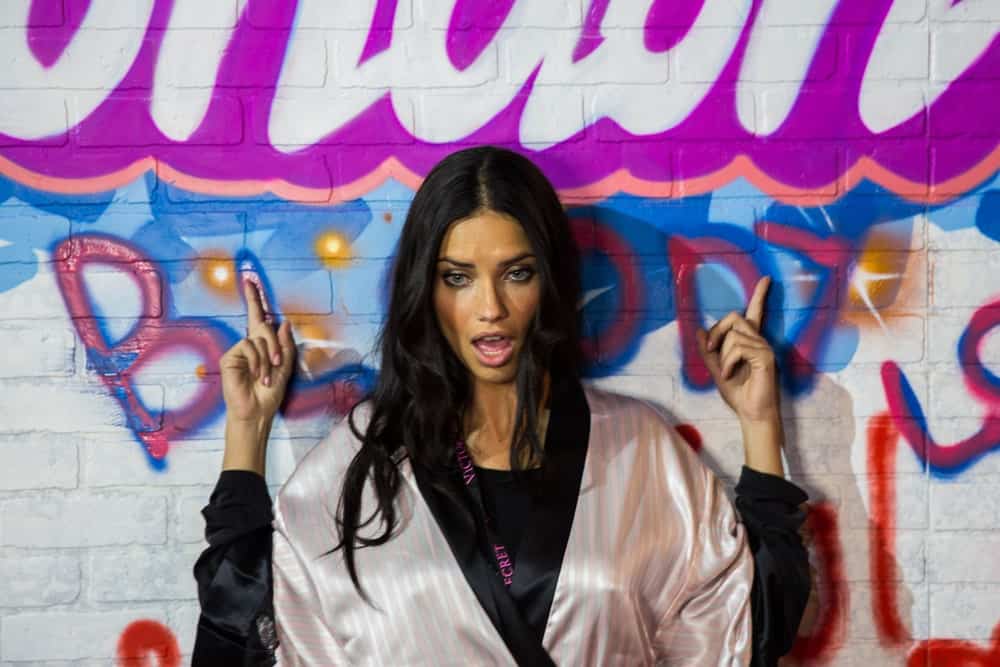The beautiful Brazilian model poses backstage with her bathrobe and tousled long dark hair at the annual Victoria's Secret fashion show last December 2, 2014 in London, England.