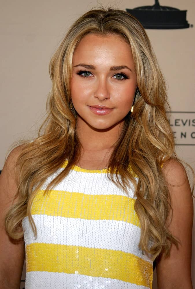 The model showcased a chic look with a striped yellow dress accentuated by her long tousled hair that's highlighted. This was worn during the Academy of Television Arts & Sciences Presentation An Evening with