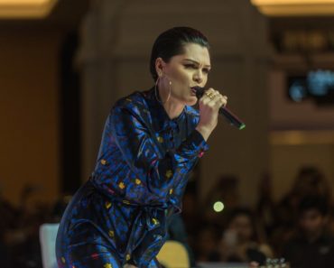 Jessie J. performed at the Dubai Shopping Festival Fashion Show in Mall Of The Emirates on the 20th of January 2017. She rocked the stage with a colorful romper to match her stylish slicked-back pixie hair.