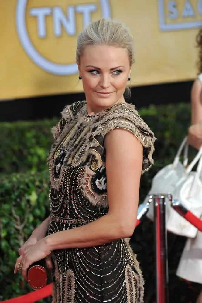 Malin Akerman's light blonde hair was styled in a sophisticated pinned-up hairstyle to match her detailed dress at the 20th Annual Screen Actors Guild Awards, January 18, 2014.