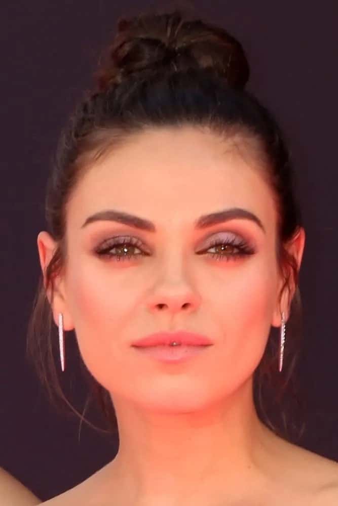 Mila Kunis wore her brunette hair in a gorgeous top knot with a few tendrils on the sides framing her face during the Billboard Music Awards 2016 last May 22, 2016.