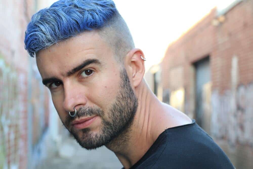 Blue-haired man in an undercut.