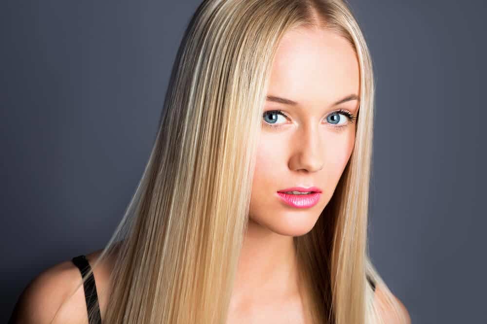 A young model with straight, blonde hair.