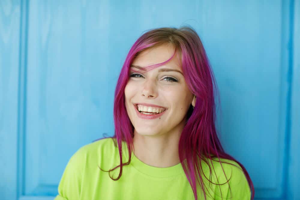 Young, beautiful woman with dyed, purple hair.