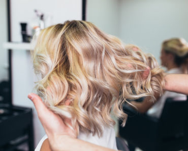 Woman with blonde fine hair at hair salon