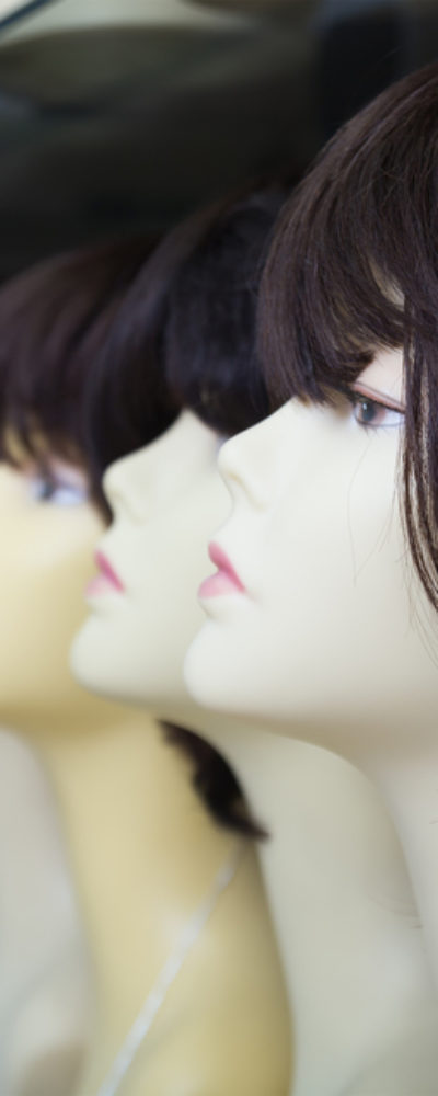 Modish wigs worn by mannequins.