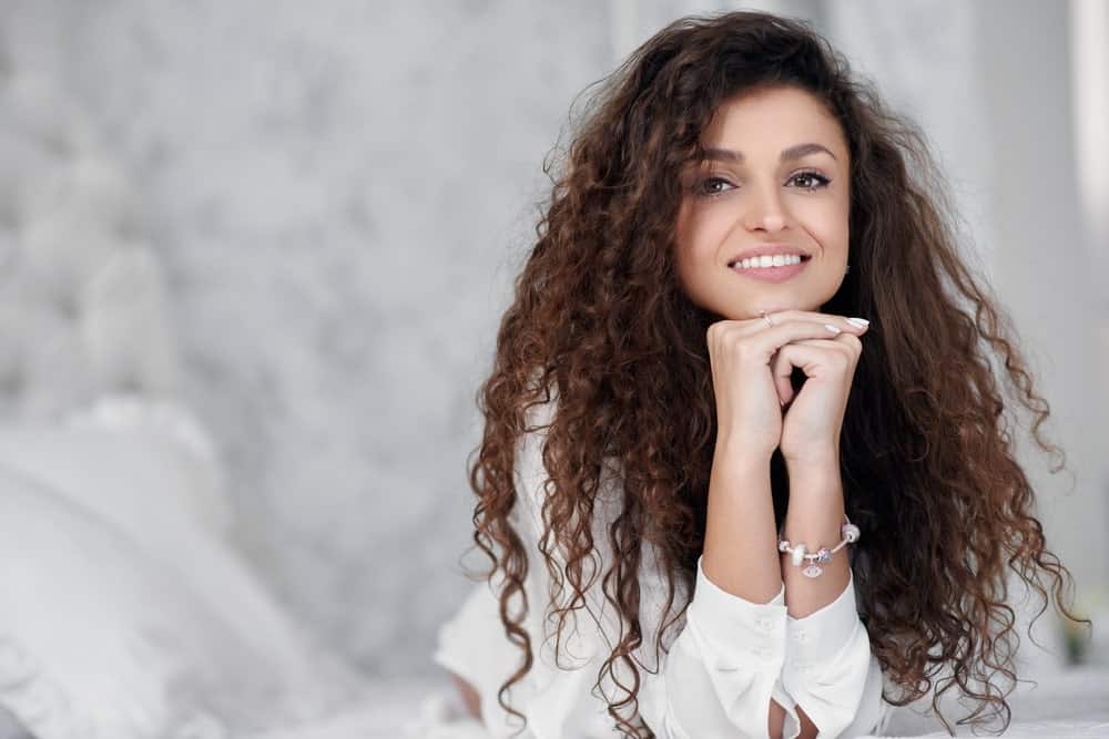 Long curly hair on a brunette woman.
