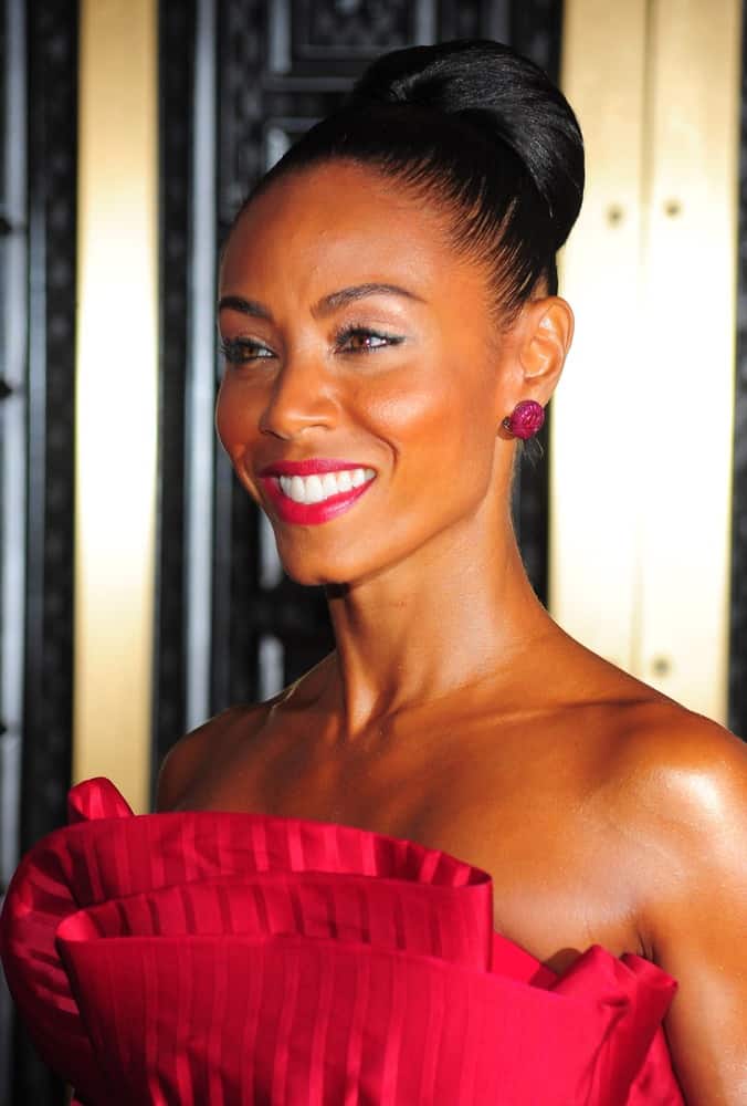 If you like bold fashion like Jada Pinkett-Smith’s red dress then a simple up-do is all you need. Brush back into a tight ponytail, then gently twist as you wrap the hair around to create a classic ballet bun. Tuck in the ends and use a rattail comb to gently loosen the bun and add volume.