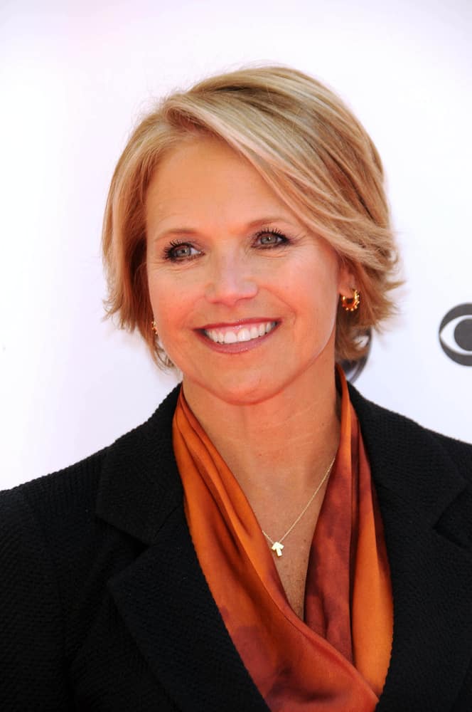 This eighth hairstyle is modeled by Katie Couric. The style features a light blonde color, complemented by chestnut-colored highlights. The style can be seen as a longer form of the well-known pixie cut and is supplemented by the short layers of the hair being curled away from the face.