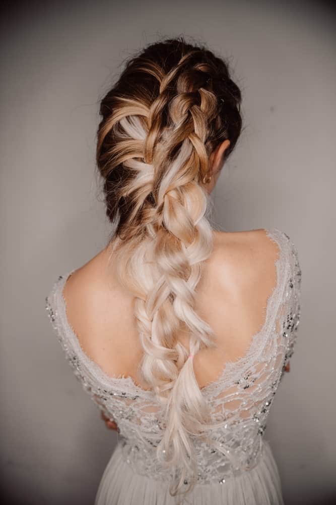 This is a beautiful hairstyle for prom. With interwoven, intricate braids it’s beautifully alluring while still being soft and not too sleek so it looks incredibly feminine.