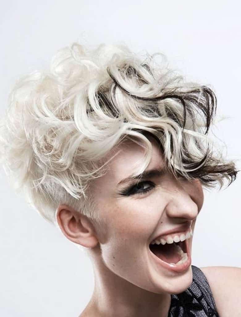 https://www.flickr.com/photos/158989044@N07/39852639404/ This wonderful hairstyle is super-short, almost shaved at the back. However, the top and front are comparatively quite long and can be styled into tousled, loose curls. Coupled with the black and silver hair color, this style has a very grunge look.