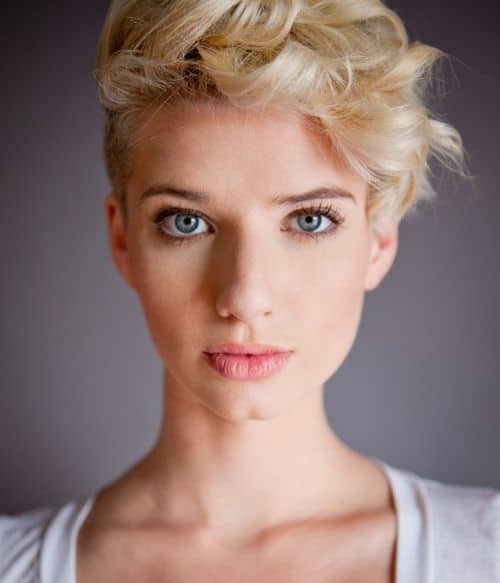 https://www.flickr.com/photos/119492517@N03/15256912921/ This pixie cut is super-short in the back and longer in the front, like a reverse mullet or tellum. This is a perfect compromise for those people who want to keep their hair off their nape but also want to frame their forehead.