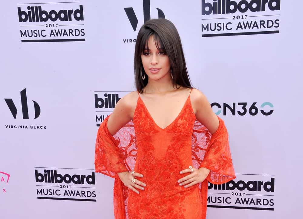 If you have long, straight and sleek hair, this is the look to go for. Style your hair with some thin and long bangs that reach your eyelashes. Give your hair an asymmetrical part and keep it straight and sleek with minimal use of product.