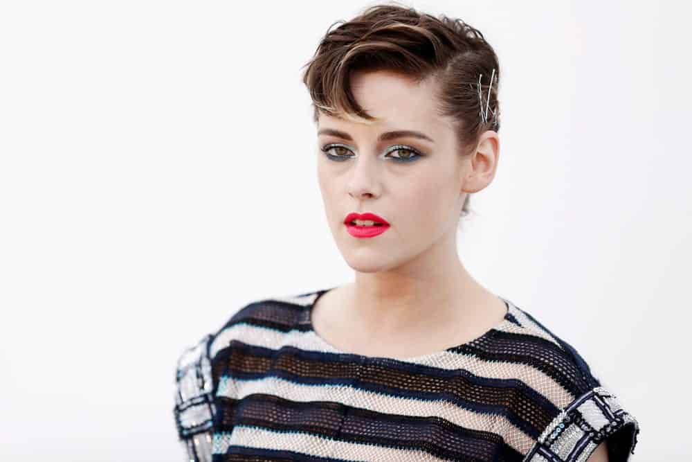 The “Twilight” actress has a love-hate relationship with her fans but you have got to appreciate her hair style. This cool rockstar pixie cut is frosted and spikes on one side with blonde highlights but is slicked back and pinned behind the ear on the other side.