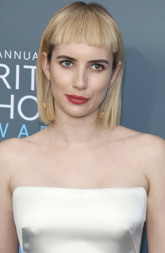 If you want this type of super-dramatic hair, be ready for frequent trims and lots of maintenance. The great thing about the blunt bang style is that they stop well above the eyes and are perfect for hiding a large forehead.