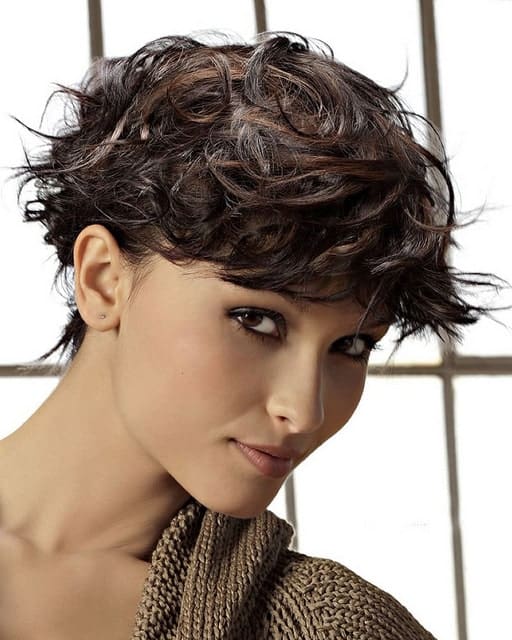 https://www.flickr.com/photos/148223039@N03/45199839512/ This stunning pixie cut has been achieved with choppy cuts, curling irons and lots of pomade. The haircut gives a very edgy and cool look and also emphasized the jawline.
