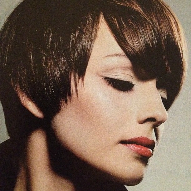 https://www.flickr.com/photos/152981057@N03/36734602452/ This stunning pixie cut has been achieved with choppy cuts, curling irons and lots of pomade. The haircut gives a very edgy and cool look and also emphasized the jawline.