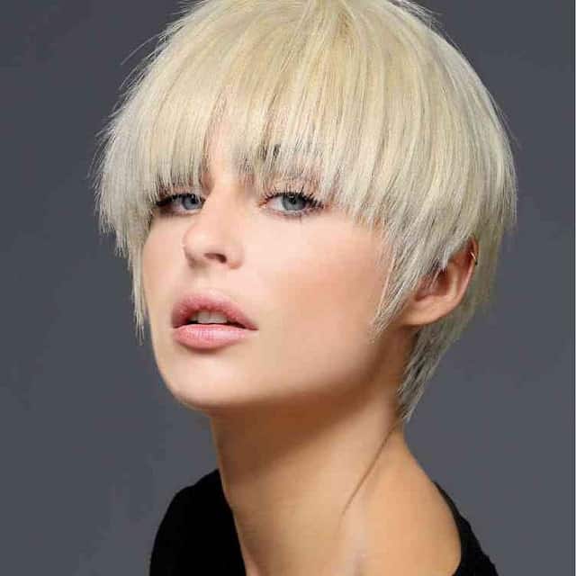 https://www.flickr.com/photos/hairboutique/8356917970/ The young woman is sporting a pin-straight pixie hair style. The front of the hair is quite long and frames her eyes and cheeks beautifully.