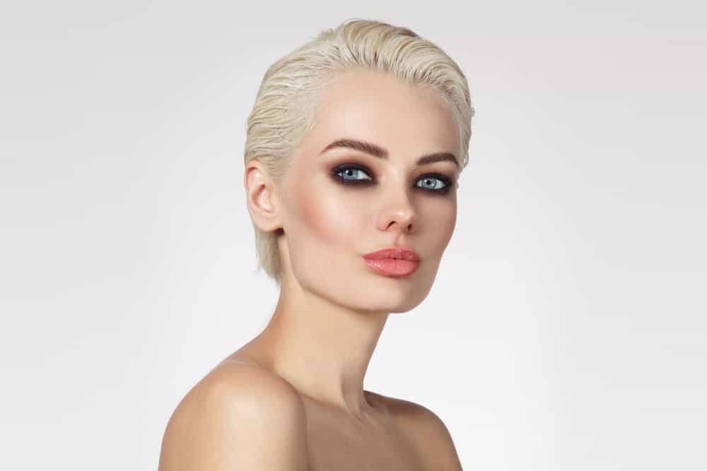 The young woman shows you can wear your pixie cut gelled back. This is a no-fuss look ideal for the office or for any formal event.