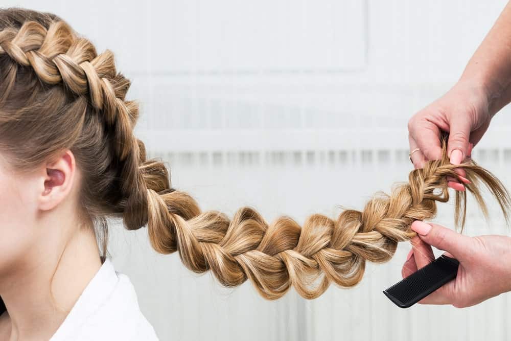 Also called the inverted French braid or the pineapple braid, the Dutch braid sits up from the rest of the hair, instead of under it. The style gives your hair a very volumizing look and looks great with both mid length as well as long hair. Try this hairstyle instead of your traditional pigtails and you’ll be the center of attention.