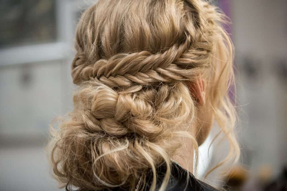 The wraparound braid is one of the most preferred hairstyle for fancy events. However, you can rock this look for casual outings as well. Twist a thick lock of hair into a braid around your head, and for a casual look, pull a few strands loose to frame your face. If you want, you can make further braids form the loose hair or just let it flow down.