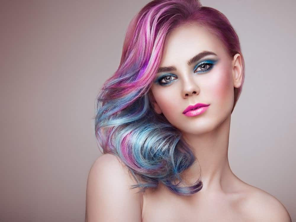 Have a flight of fantasy with parti-colored mermaid hair. If you are a fan of the super-casual and eclectic looks, this is one of the ombre styles you should try. Ask your stylist to paint in a combination of bright, vivid, rainbow colors like pink, purple, green and aqua, to achieve this super-sultry effect.