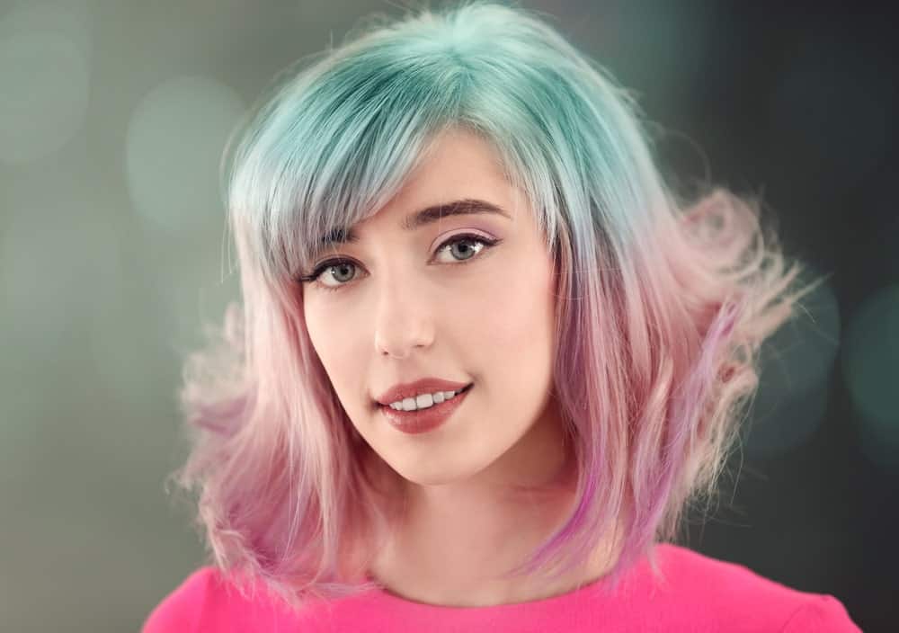 This hairstyle can really make you stand out in the crowd. First, the unique combination of soft pastel shades of different colors adds individuality to your look. On top of that, the hairstyle with side bangs and hair blow-dried to the front adds the final touches the hairstyle required to look this exquisite. 