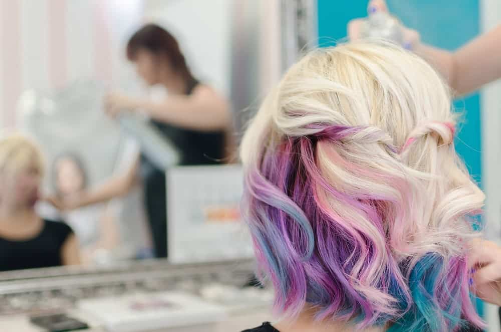 Here’s another example of how waves can accentuate the colors in your hair. Add a little interest in your hairstyle with a looped side twist at the back of your hair. It will only accentuate the colors. 