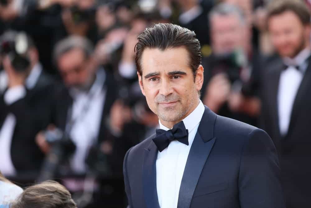 This great hairstyle worn by Colin Farrell is perfect for those men who want to keep their hair away from their face. Here, Farrell has kept the top of his hair about 4 to 6 inches long. However, his sides have been clipped shorter, but not too much. The shorter sides give his style balance and the top of his hair more volume. The slicked-back look gives Farrell a tidy appearance and is eye-catching and dramatic. It is a wonderful outgoing style.