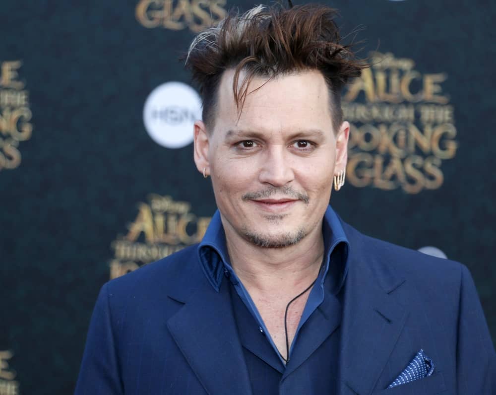 Known for playing eccentric, and often times, dark roles, Johnny Depp often displays his unconventional tastes with his choice of apparel and hairstyle. Here, “The Fantastic Beasts” actor’s barber has styled his thick hair into gelled-up and slicked back spikes. He has also give Depp an edgy-looking forelock. The style is very unusual but fits Depp very well. For those who are not afraid of edgy, out-of-this-world styles, this slicked-back style is a masterpiece.