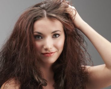 Women grabbing her frizzy hair