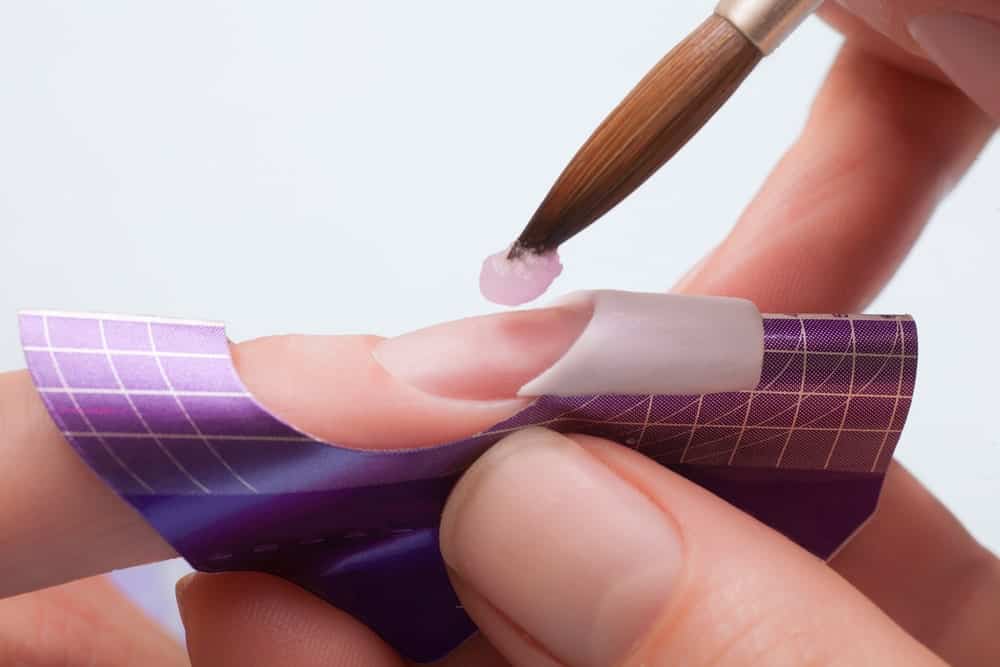 Acrylic nail process at a beauty salon