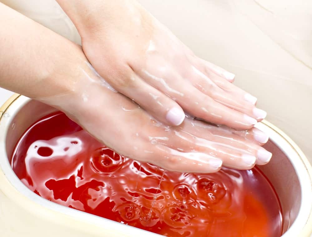 Paraffin manicure at a beauty salon