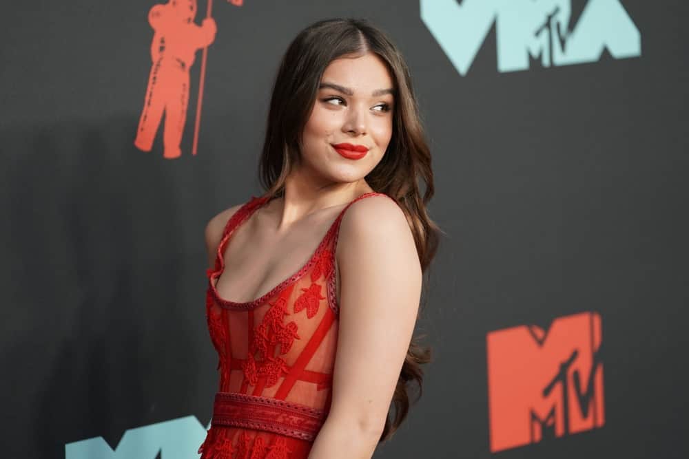 The singer arrives for the MTV Video Music Awards held on August 26, 2019, in a chic dress and matching red lipstick. She finishes the look with a permed hair showcasing gorgeous waves.