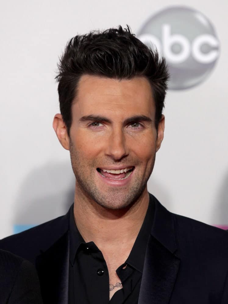 Adam Levine was at the American Music Awards 2011 on November 20, 2011 in Los Angeles, CA. He was dapper in his black smart casual outfit and slick brushed up undercut hairstyle.