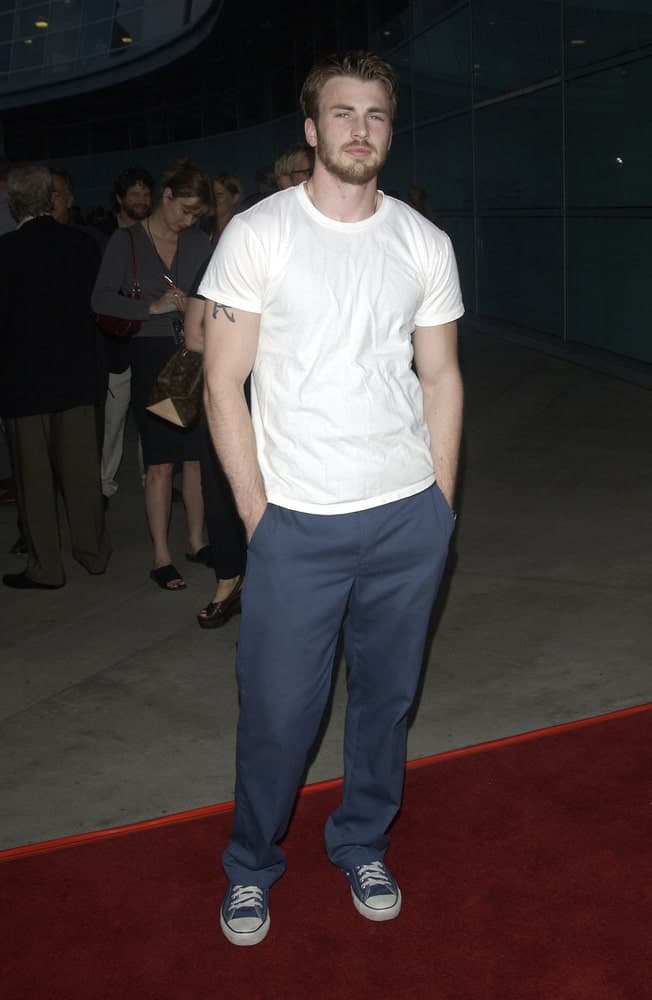 The young actor Chris Evans wore a simple and casual white shirt to emphasize his beautiful face and spiked fade hairstyle with a slight side-parted look at the world premiere of "Freddy vs. Jason" on Aug 13, 2003 in Hollywood.