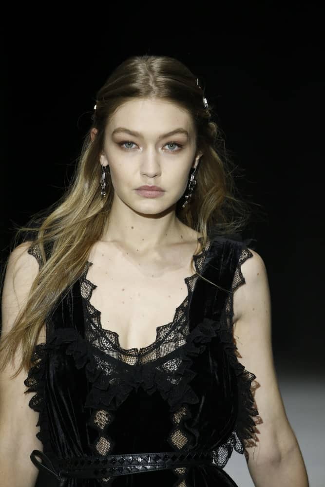 Gigi Hadid was quite lovely with her black dress and pinned half up hairstyle when she walked the runway at Bottega Veneta Fall/Winter 2018 Collection at the American Stock Exchange on February 9, 2018 in New York City.