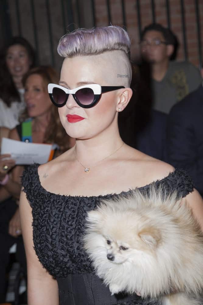 Kelly Osbourne, looking as gorgeous as ever, carrying her dog during the New York Fashion week Spring/Summer 2017, September 10 at Art Beam.