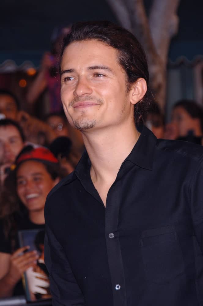 Actor ORLANDO BLOOM was seen with a gorgeous low ponytail at the world premiere of his new movie 