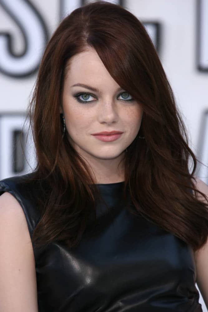 On August 12, 2010, Emma Stone’s mesmerizing eyes were emphasized by her dark straight hair with long side-swept bangs at the 2010 MTV Video Music Awards, Nokia Theatre L.A. LIVE in Los Angeles, CA.