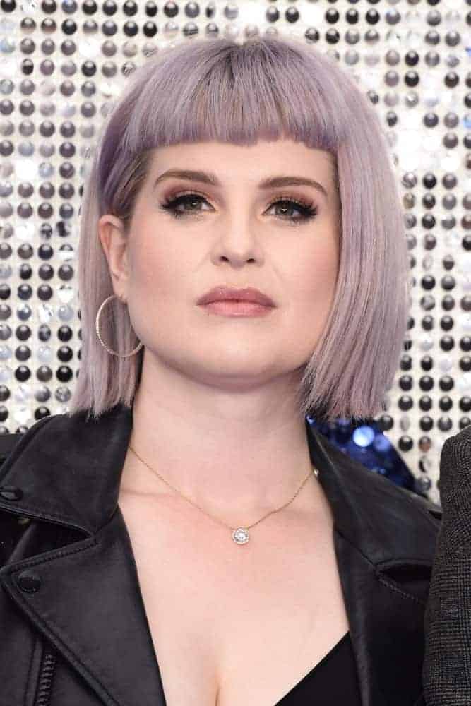 Kelly Osbourne attending the “Rocketman” UK premiere in Leicester Square, London with a faded purple bob and blunt bangs. The photo was taken on May 20, 2019.