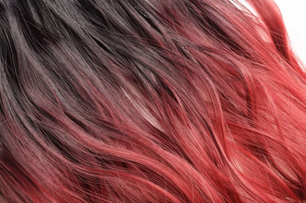 Closeup of a woman's red dual-toned dyed hair.